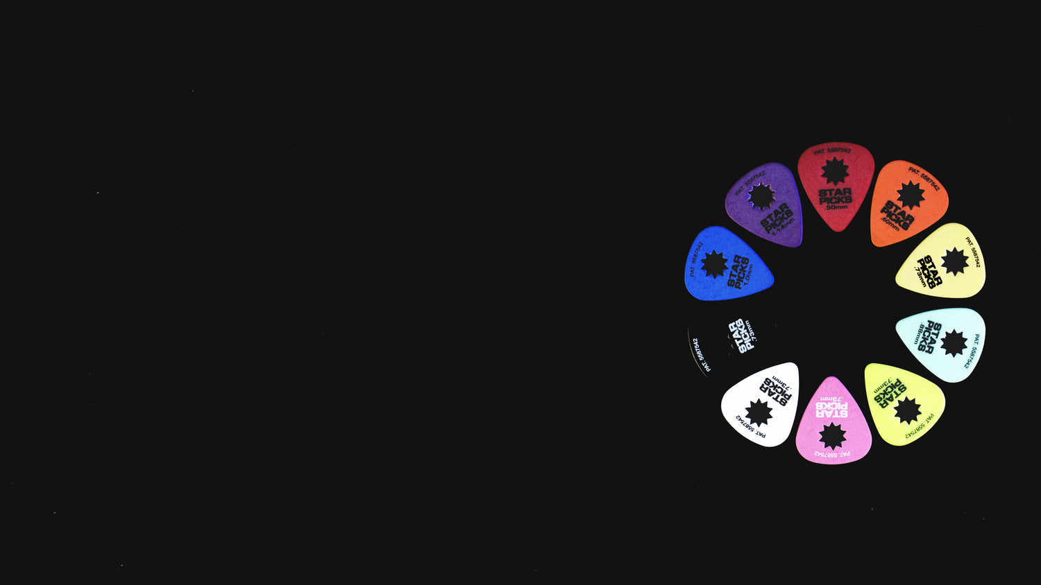 Cleartone guitar picks arranged in a multicolored circle