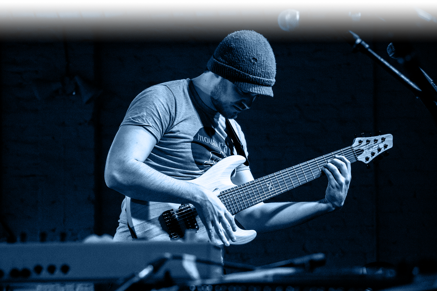 Rob Scallon playing guitar onstage using Cleartone Strings