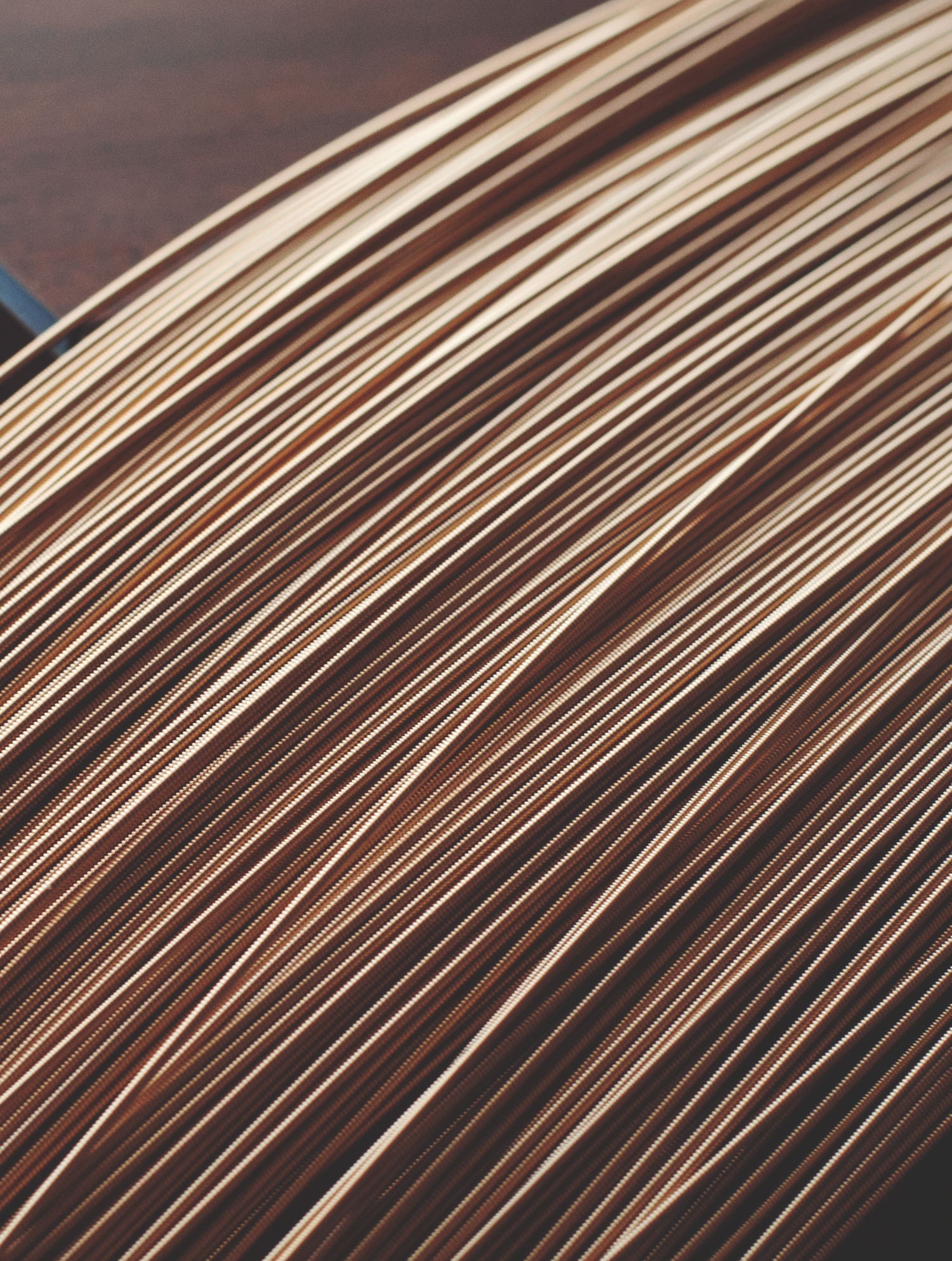 section shot of hundred of coiled phosphor bronze acoustic guitar strings