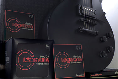 Black guitar with bright red Cleartone String package