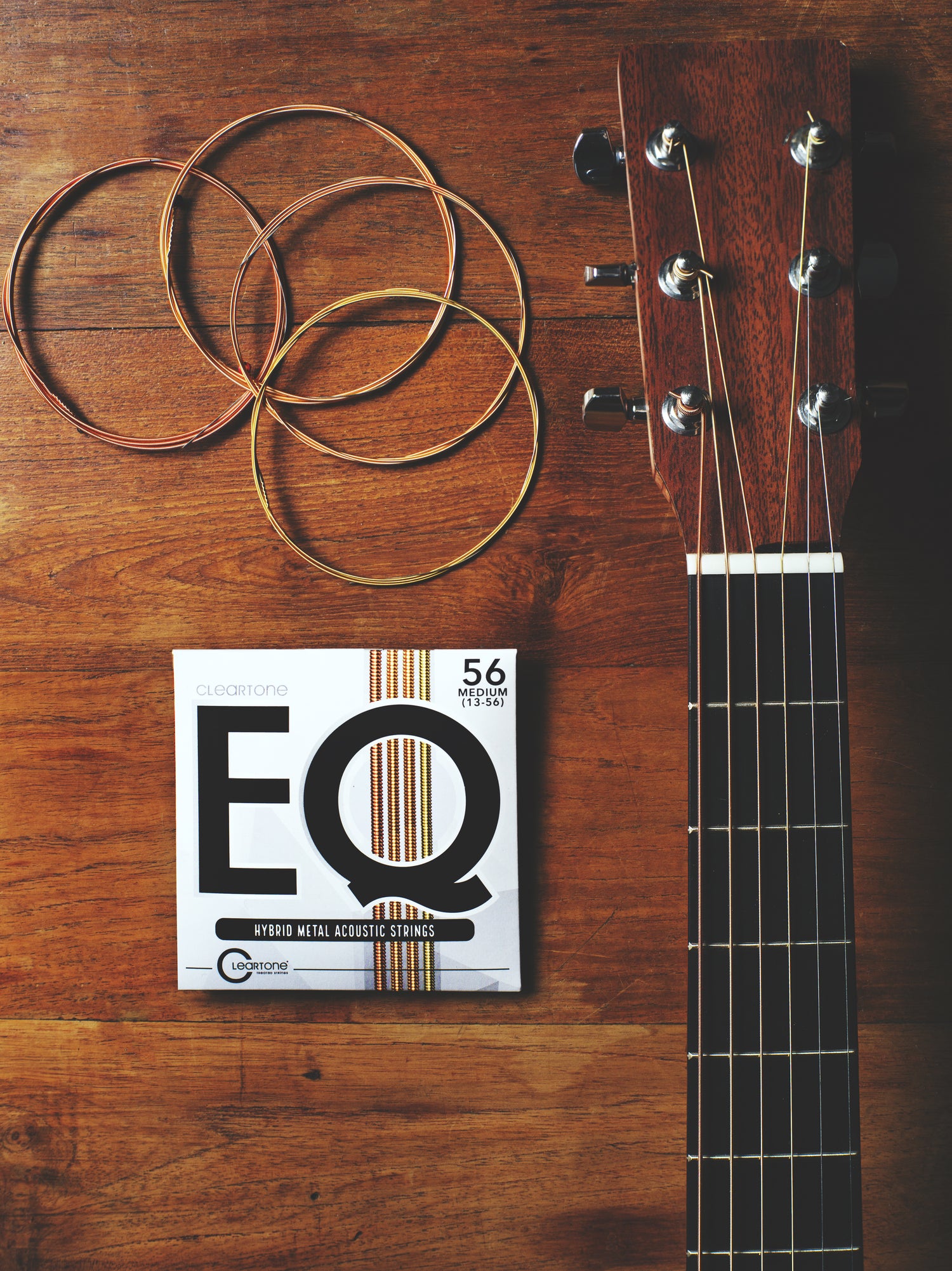 Cleartone Strings EQ packaging next to a guitar