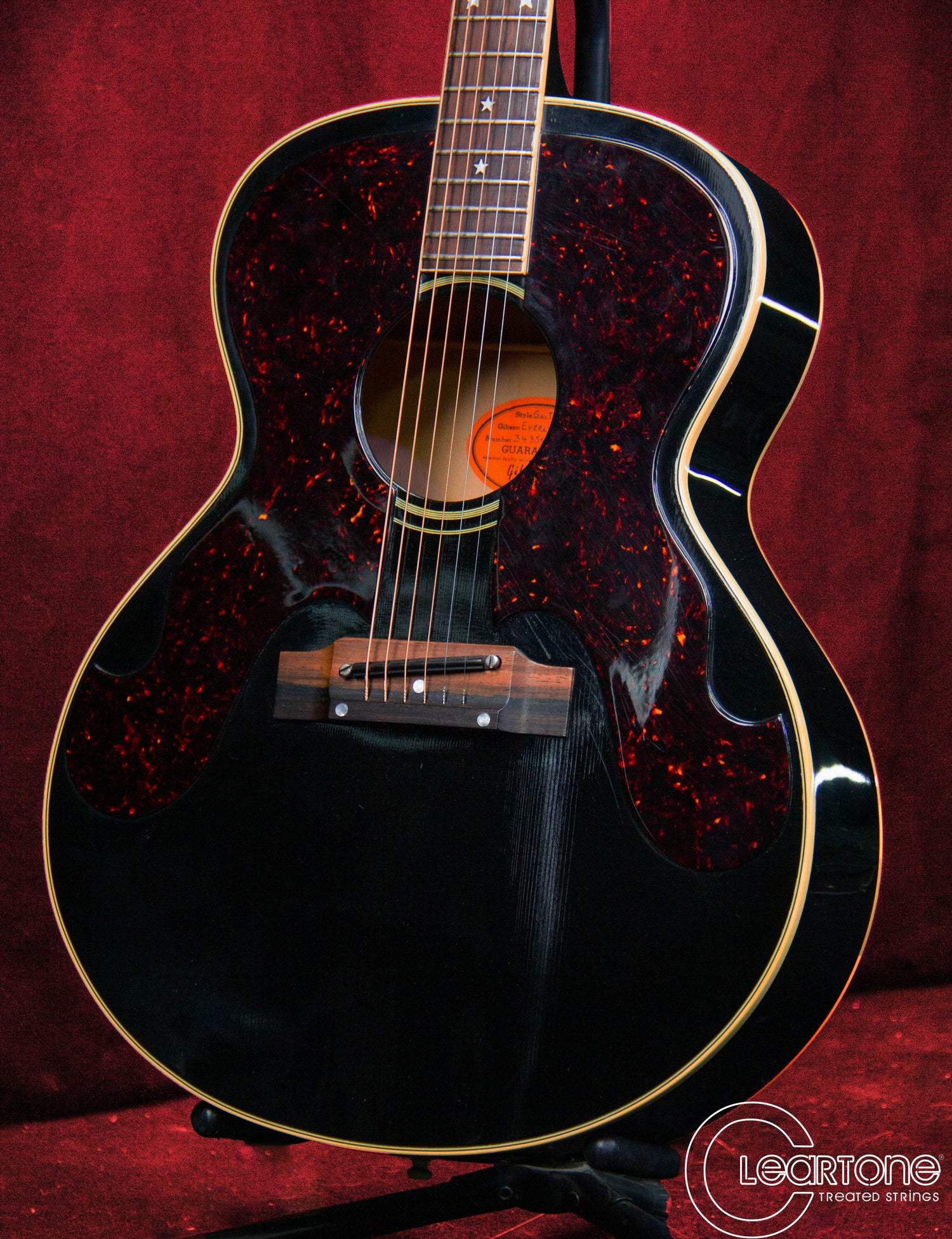 embossed acoustic guitar on a stand
