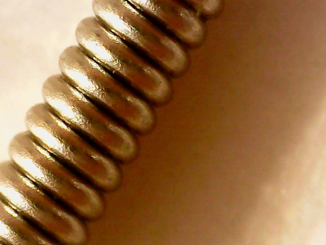 closeup of a phosphor bronze guitar string